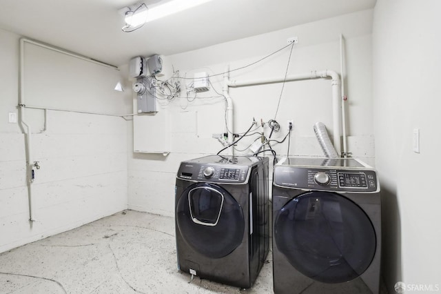 washroom with independent washer and dryer