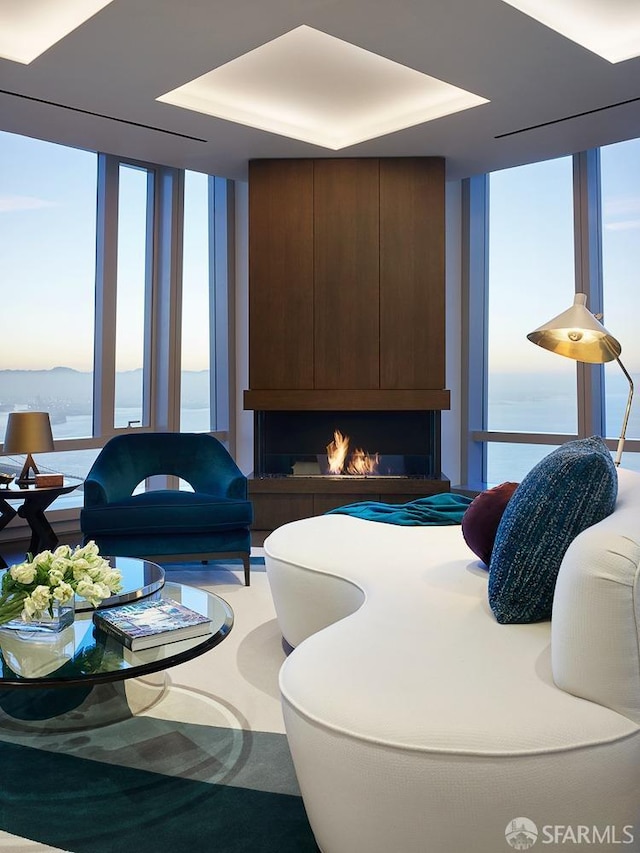 living room featuring floor to ceiling windows and plenty of natural light