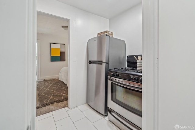 32-34 Gough St, San Francisco, CA 94103 - kitchen featuring stainless steel gas stove and light tile patterned floors