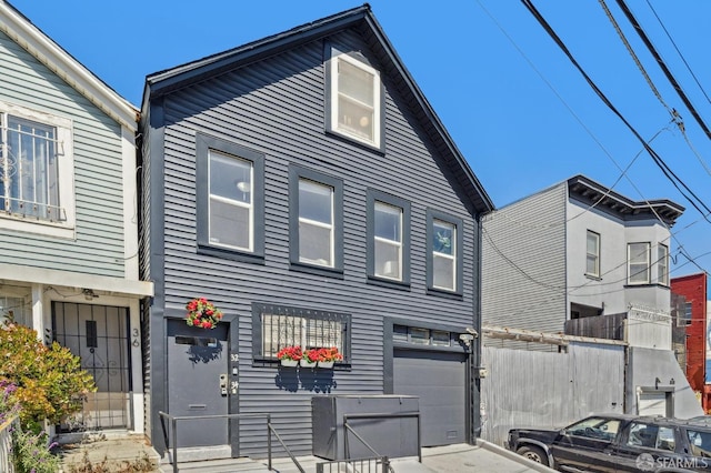 32-34 Gough St, San Francisco, CA 94103 - view of property featuring an attached garage and concrete driveway