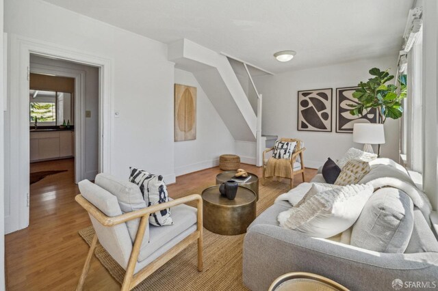 32-34 Gough St, San Francisco, CA 94103 - living area with wood finished floors, stairway, and baseboards