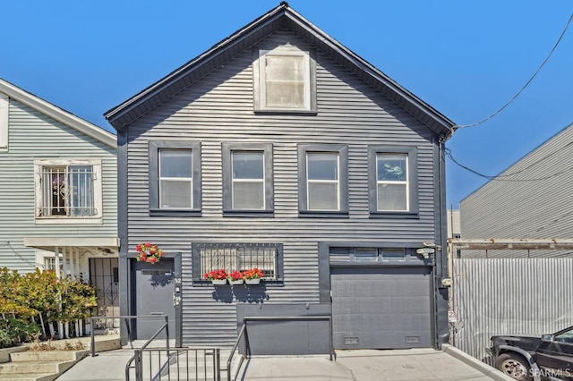 32-34 Gough St, San Francisco, CA 94103 - townhome / multi-family property with a garage, driveway, and a gate
