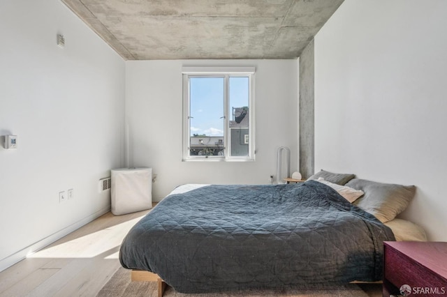 bedroom featuring wood finished floors