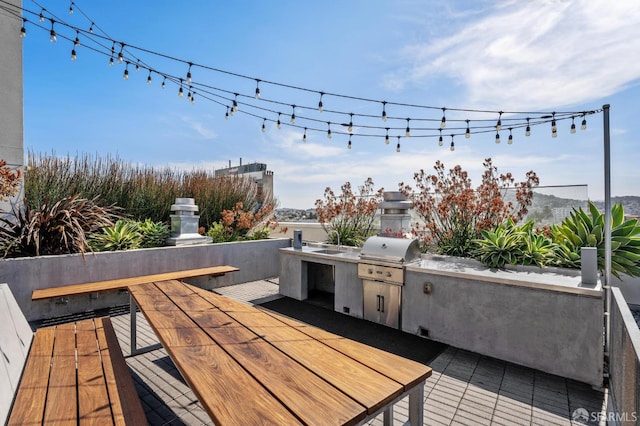 deck featuring an outdoor kitchen and grilling area