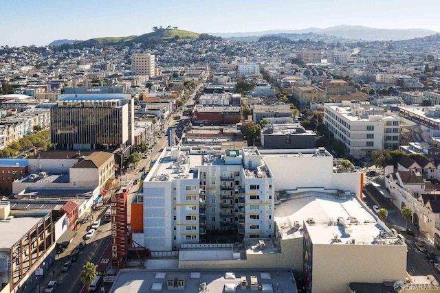 aerial view with a mountain view and a view of city