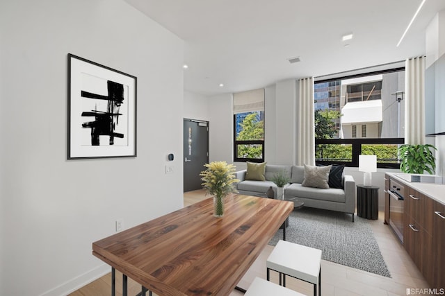 dining area with light hardwood / wood-style floors