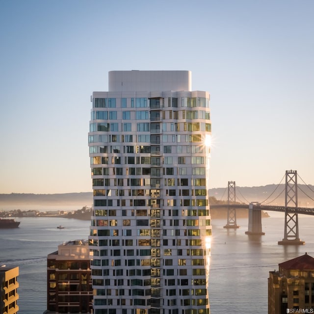 outdoor building at dusk featuring a water view