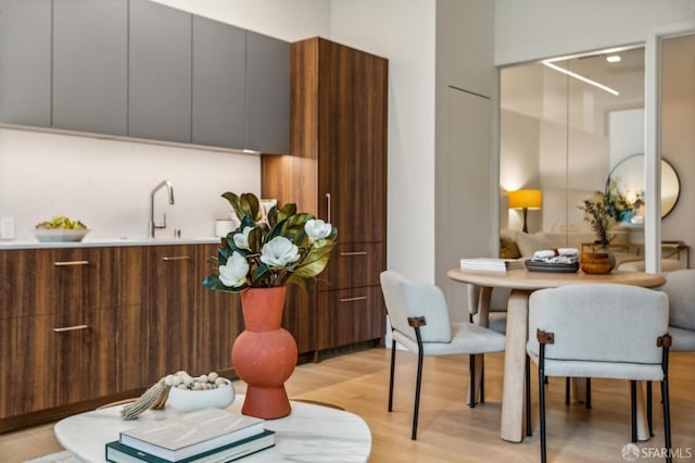 dining space featuring light wood-type flooring