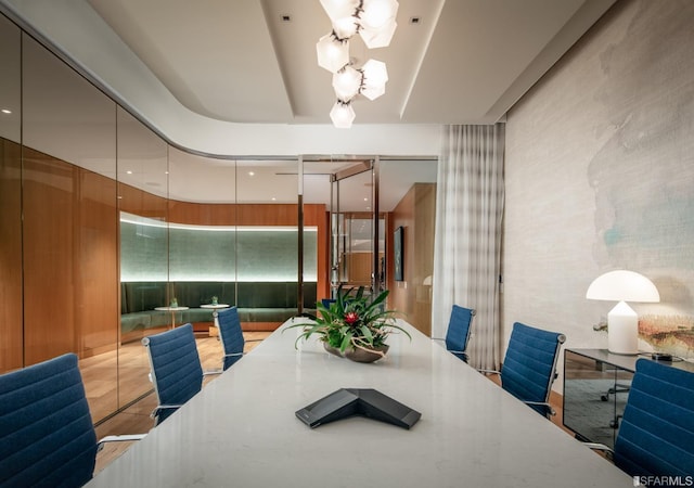 dining area with an inviting chandelier and light wood-type flooring