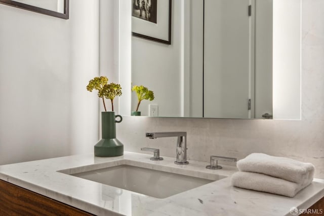 bathroom featuring backsplash and vanity