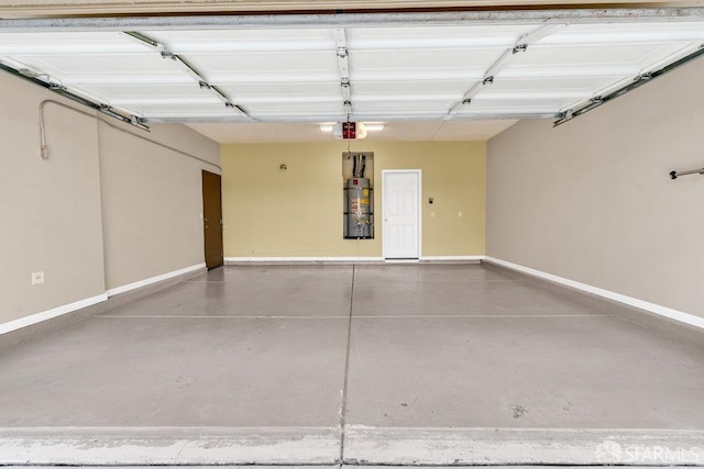 garage with strapped water heater and a garage door opener