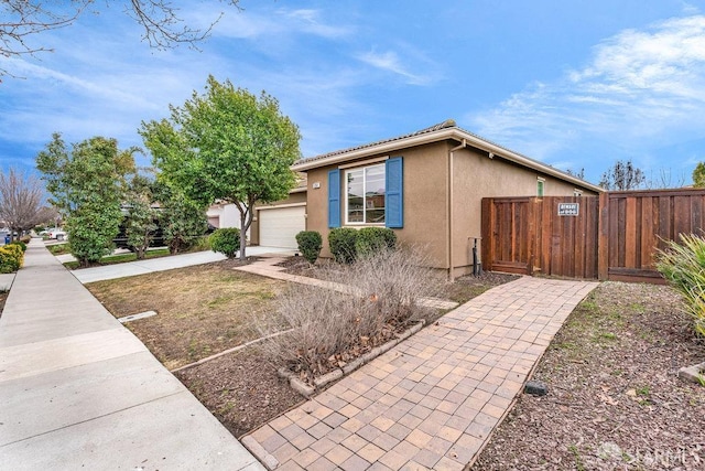 view of property exterior featuring a garage