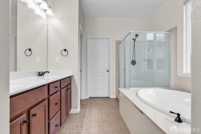 bathroom with tile patterned floors, separate shower and tub, and vanity