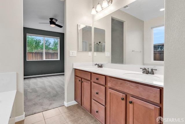 bathroom with ceiling fan, tile patterned floors, and vanity