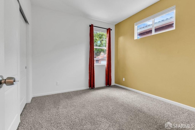 empty room featuring carpet flooring