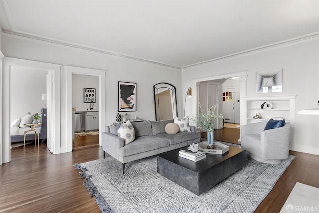 living area with crown molding and dark wood-style flooring