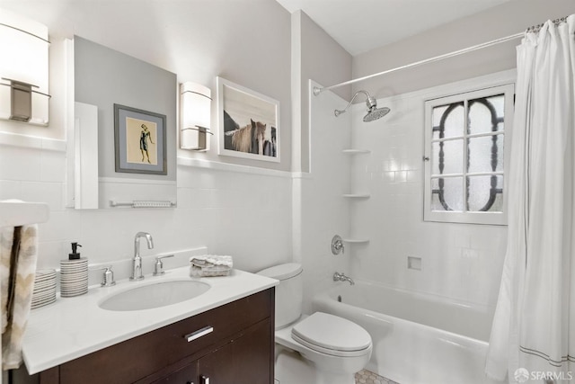 bathroom featuring shower / bath combination with curtain, tile walls, toilet, and vanity