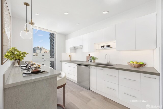1070 Green St Unit 1001, San Francisco, CA 94133 - kitchen with hanging light fixtures, white cabinets, a sink, modern cabinets, and dishwasher