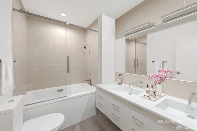 1070 Green St Unit 1001, San Francisco, CA 94133 - bathroom featuring shower / bath combination with glass door, a sink, toilet, and double vanity