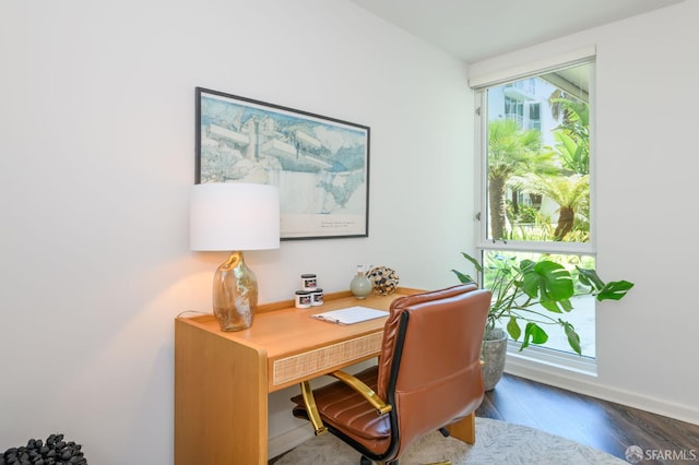 office with wood finished floors and baseboards