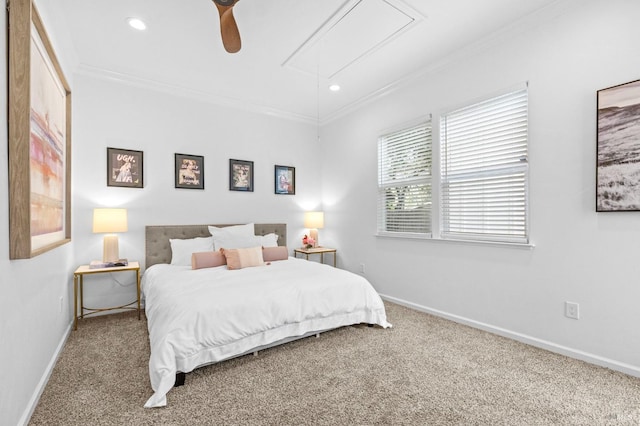 carpeted bedroom featuring ceiling fan and crown molding