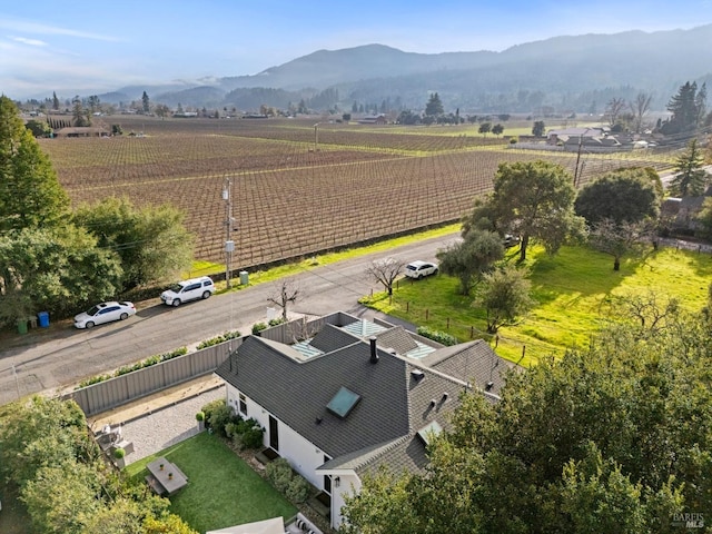 birds eye view of property featuring a mountain view and a rural view