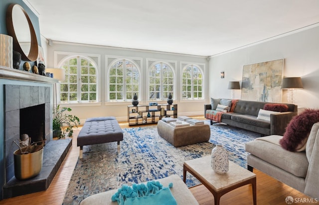2932 Baker St, San Francisco, CA 94123 - living area with ornamental molding, wood finished floors, a tile fireplace, and baseboards