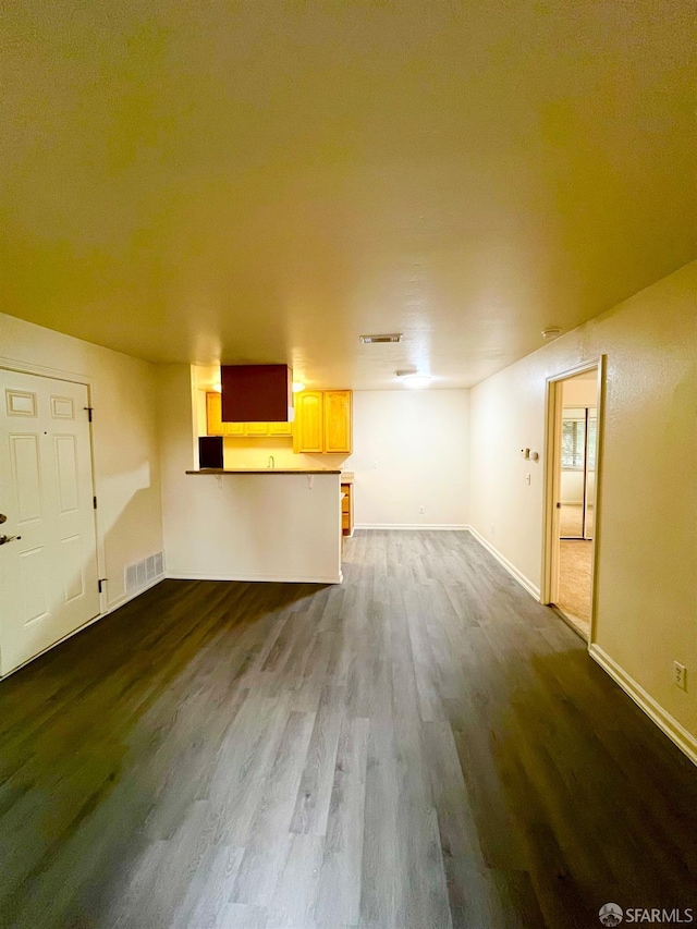 unfurnished living room with hardwood / wood-style floors