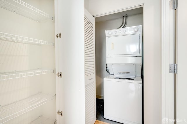 washroom with stacked washer and dryer