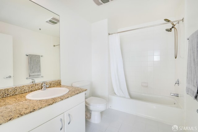 full bathroom with tile patterned floors, vanity, toilet, and shower / tub combo with curtain