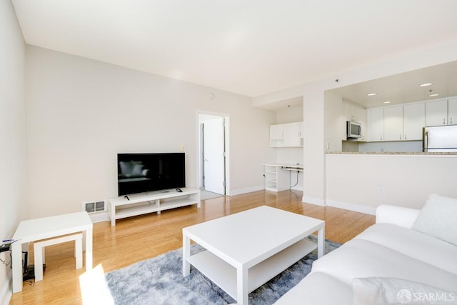 living room featuring light hardwood / wood-style floors