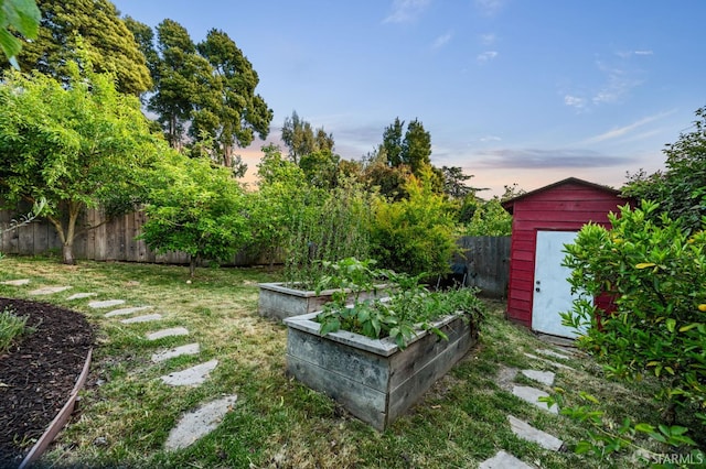 4551 Fairbairn Ave, Oakland, CA 94619 - fenced backyard with a storage shed and a vegetable garden