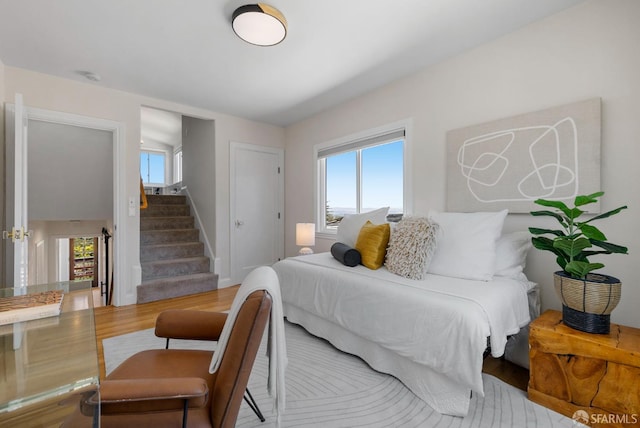 4551 Fairbairn Ave, Oakland, CA 94619 - bedroom with multiple windows and wood finished floors