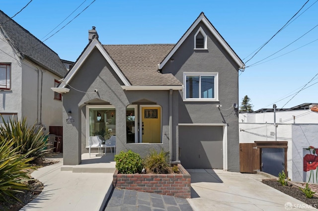 4551 Fairbairn Ave, Oakland, CA 94619 - view of front of property with stucco siding, an attached garage, concrete driveway, a chimney, and a porch
