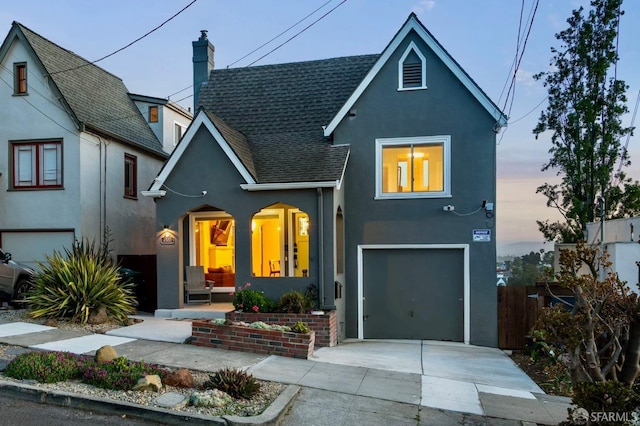 4551 Fairbairn Ave, Oakland, CA 94619 - view of front of property with stucco siding, roof with shingles, a garage, concrete driveway, and a chimney