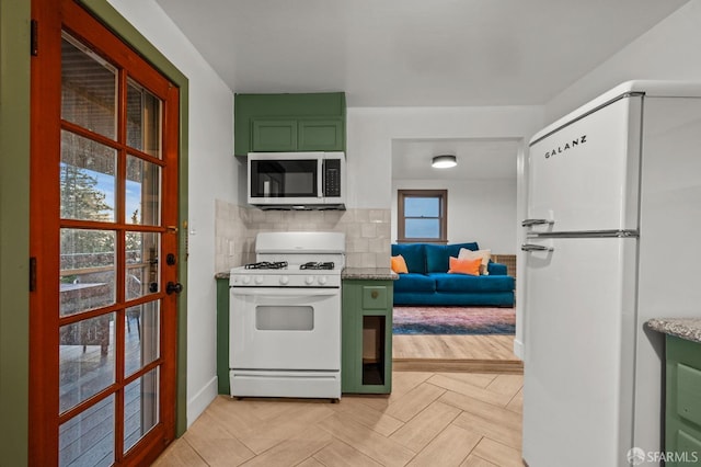 4551 Fairbairn Ave, Oakland, CA 94619 - kitchen with white appliances, green cabinetry, tasteful backsplash, and light stone counters