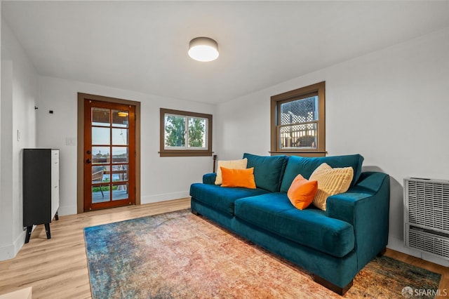 4551 Fairbairn Ave, Oakland, CA 94619 - living area with heating unit and light wood-style flooring