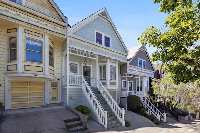 victorian-style house with stairway and a porch