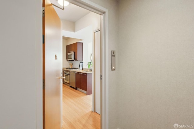 hall with light hardwood / wood-style flooring