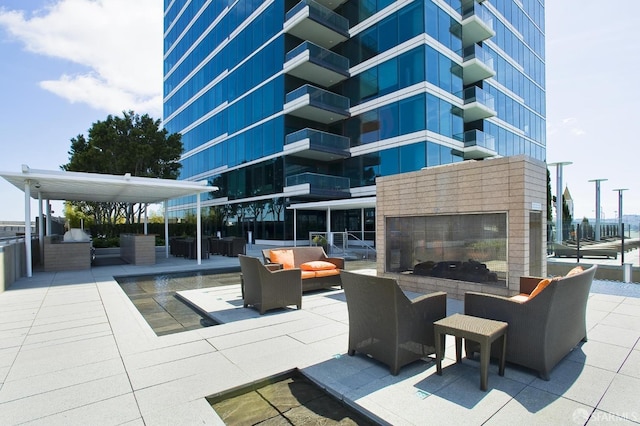 view of patio / terrace featuring an outdoor living space with a fireplace