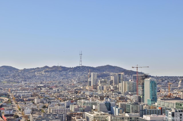 property's view of city with a mountain view