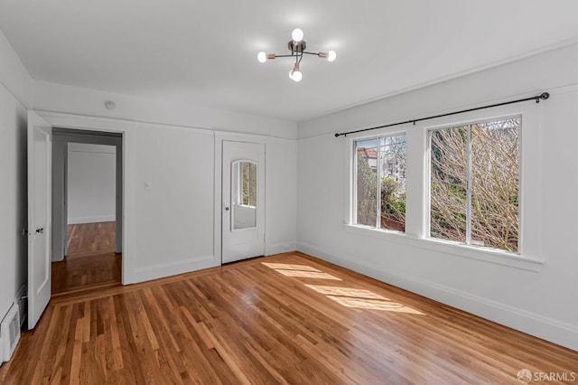 interior space featuring a closet, baseboards, and wood finished floors