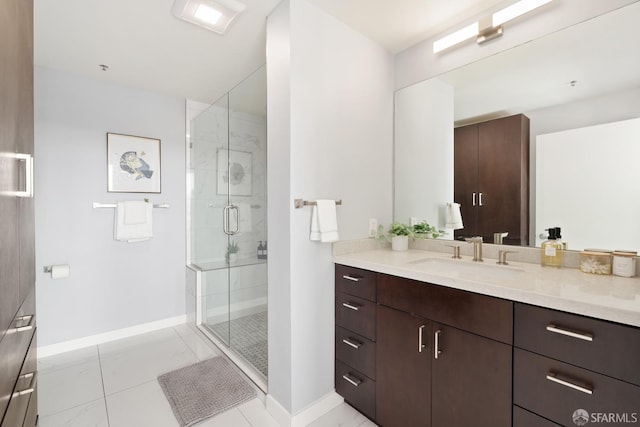 bathroom featuring vanity, tile patterned floors, and an enclosed shower