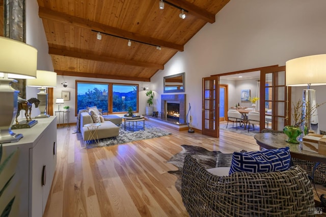 living area featuring wooden ceiling, track lighting, french doors, and wood finished floors