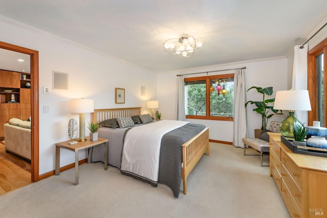bedroom with baseboards, light colored carpet, ornamental molding, and an inviting chandelier