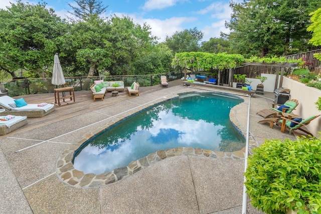 view of pool with an outdoor living space, a patio, a fenced in pool, and a fenced backyard