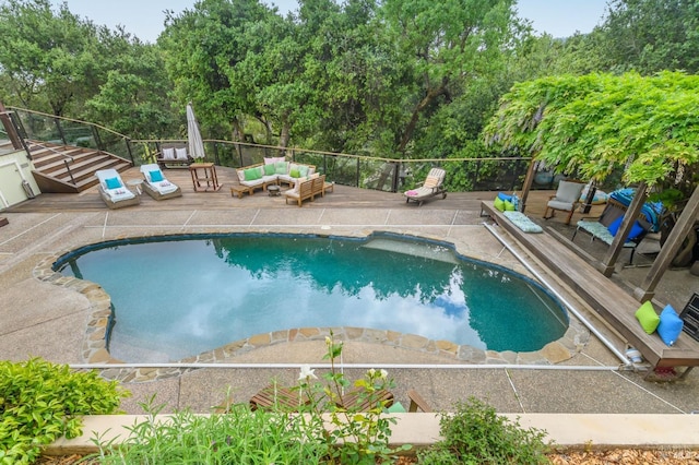 view of swimming pool with a fenced in pool, a patio, and an outdoor living space