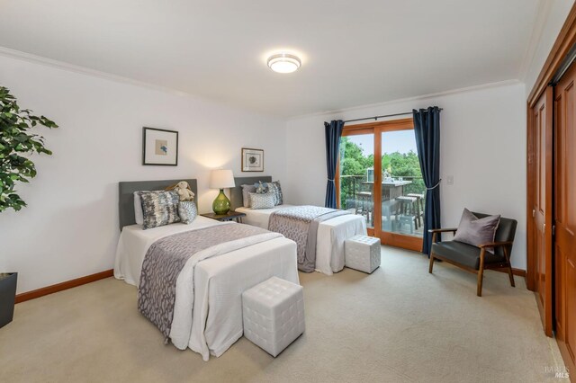 bedroom featuring baseboards, light colored carpet, ornamental molding, and access to exterior