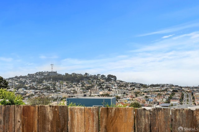 exterior space with fence and a residential view