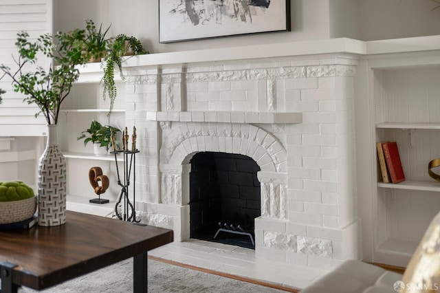interior details with a brick fireplace